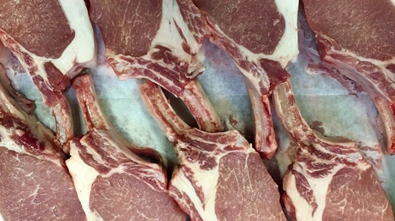 Raw bone-in pork chops