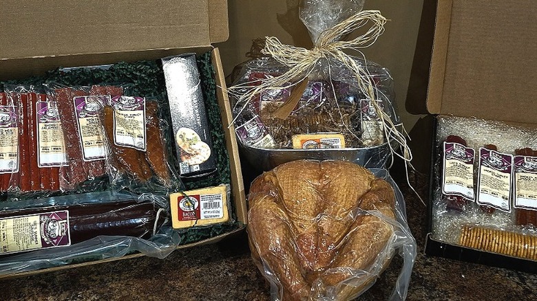 Display of smoked meats including a whole turkey.