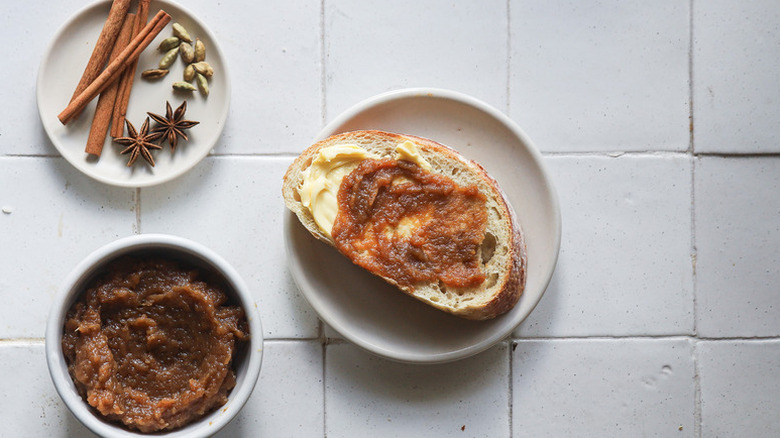 Slice of bread on a plate, topped with roasted chai apple butter