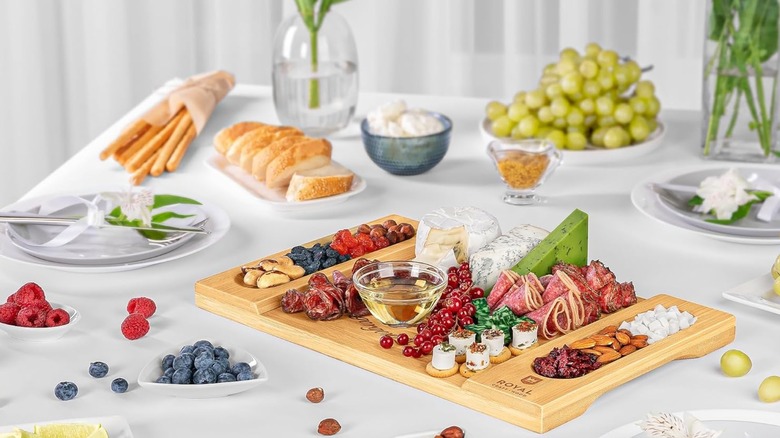 A Royal Craft Wood charcuterie board on a table