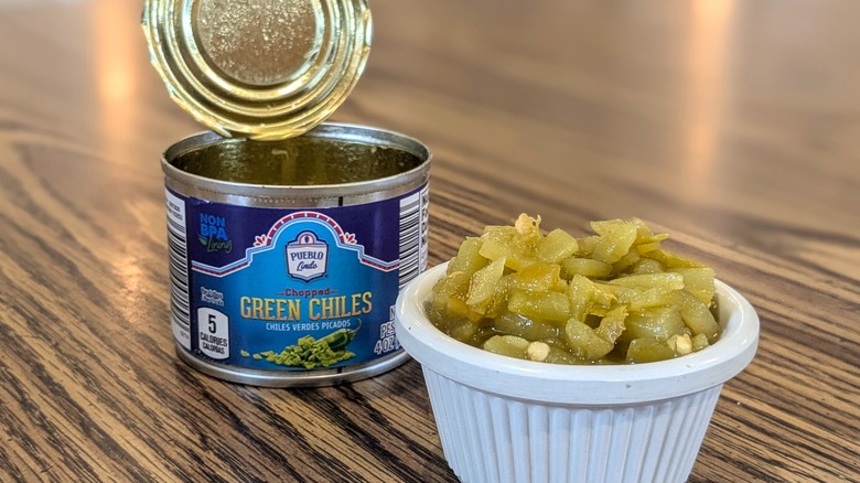 Canned diced green chiles in ramekin next to an open can