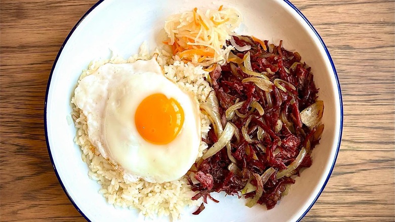 Plate with rice, egg, corned beef, and onions