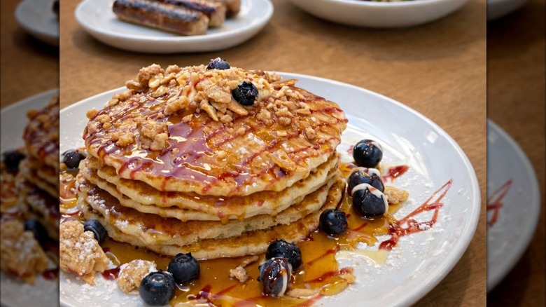 Stack of pancakes with blueberries and syrup