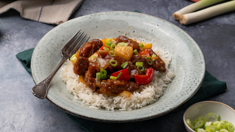 Bowl of crispy sweet and sour pork and rice