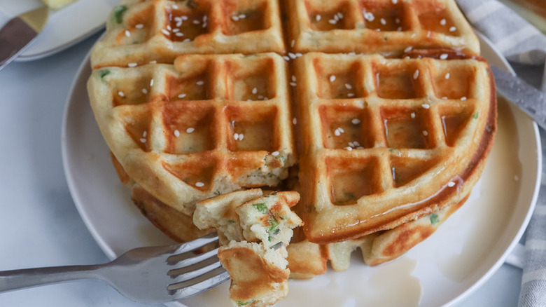 Sesame scallion waffles on plate with fork
