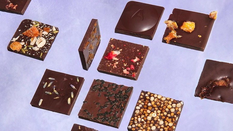 Squares of various Antidote chocolate flavors, including ones with sesame seeds and lavender
