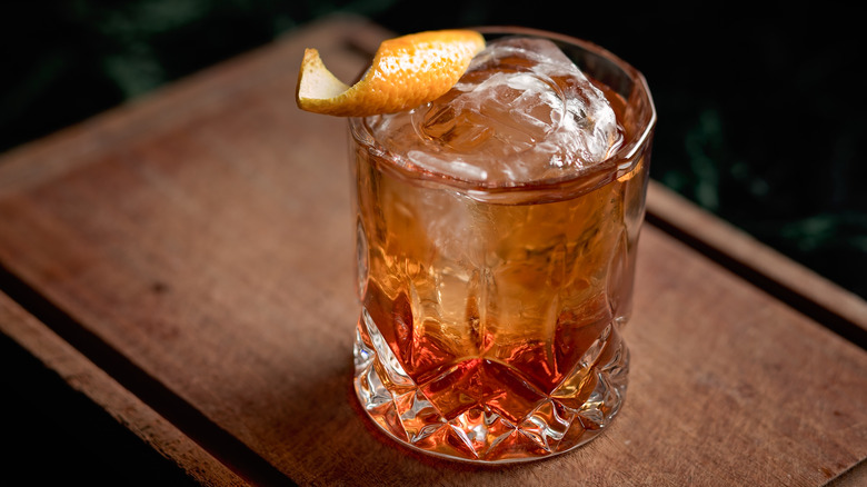 Old-fashioned cocktail with orange