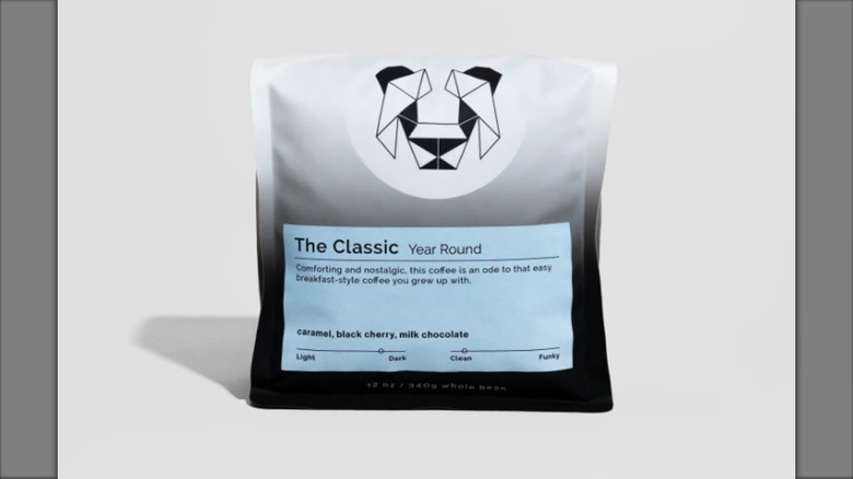 Bag of "The Classic" coffee blend from Black & White Coffee Roasters on grey background