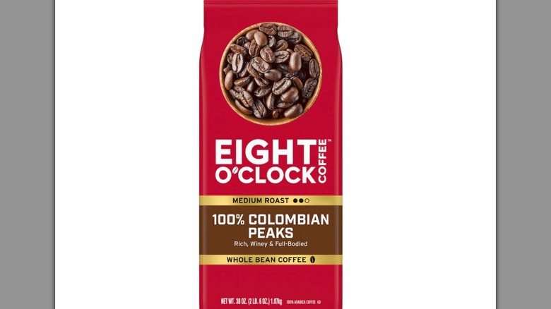 Red bag of Eight O'Clock Coffee Colombian Peaks on white background