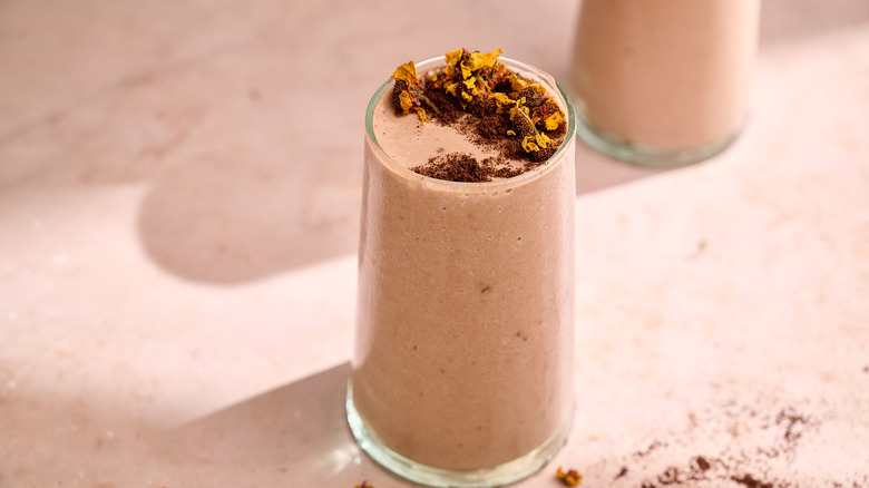 coffee smoothie in a glass with cocoa topping