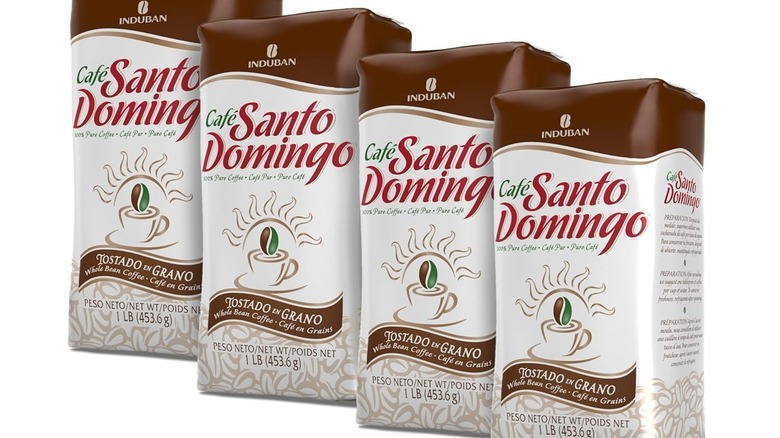 Four bags of Café Santo Domingo coffee on a white background