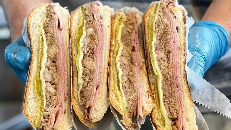 Tinta y Cafe Cuban sandwiches cut in half