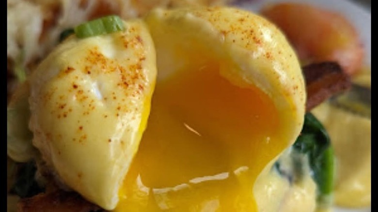 oozing egg from an eggs Benedict dish