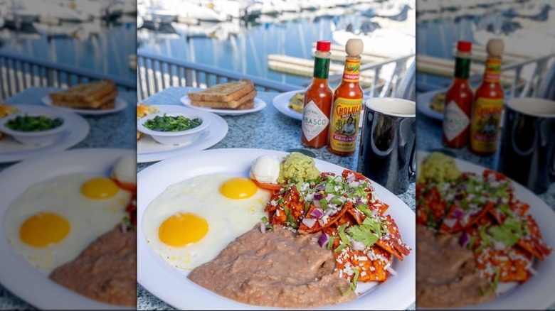 Egg chilaquiles meal at Schooner or Later with a marina view in the background