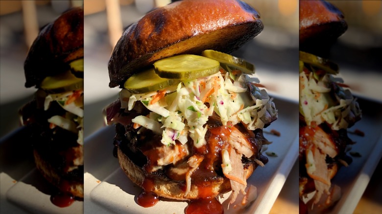 Fried chicken sandwich with coleslaw and pickles at Scolari's Good Eats
