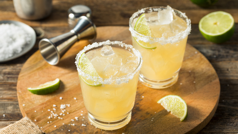two margaritas on a wooden board