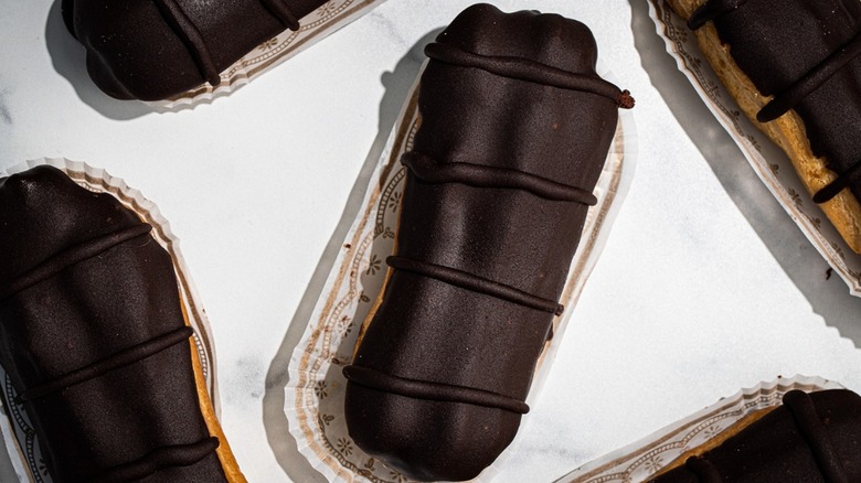 close up aerial shot of dark chocolate eclairs