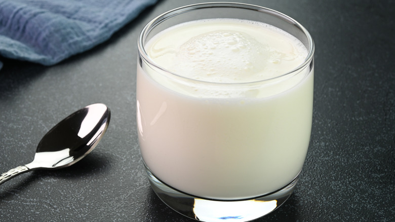 Buttermilk in a glass with spoon