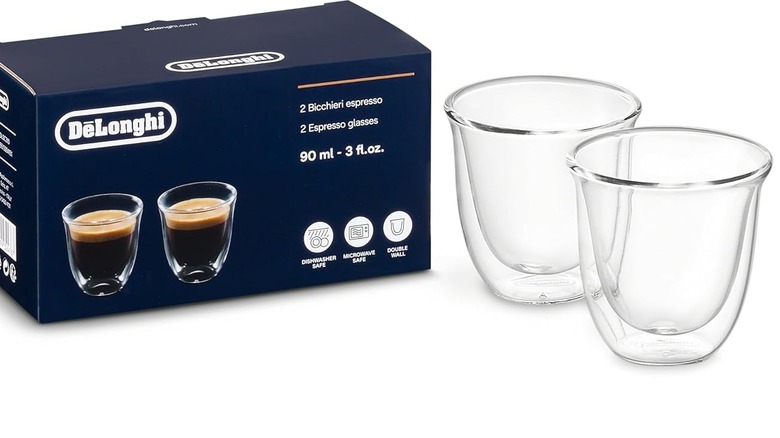 Two De'Longhi espresso glasses and box against a white background