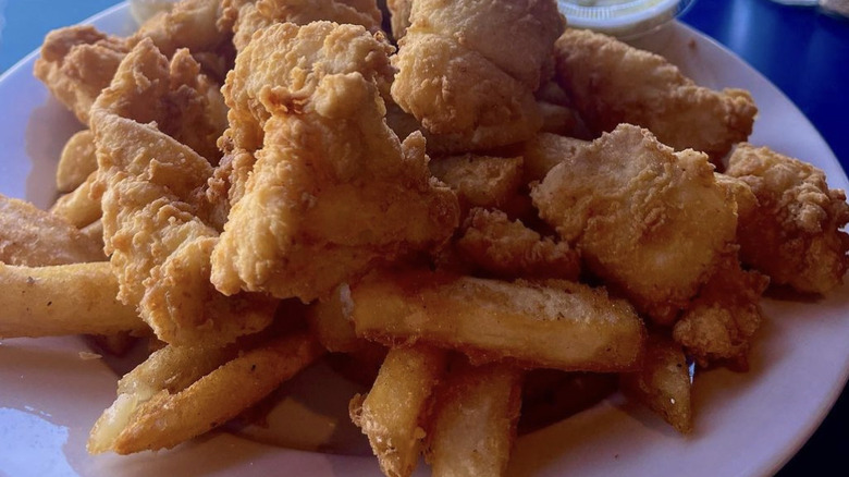 Fish, chips, and side sauces