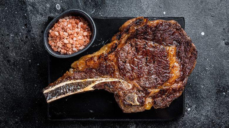 Grilled cowboy ribeye with pink salt