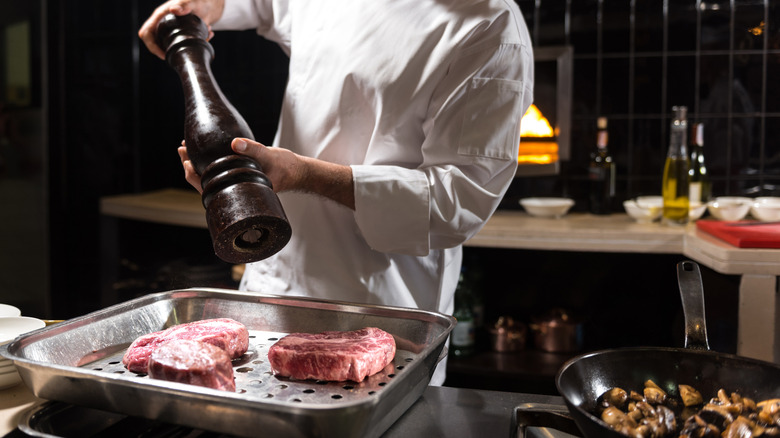 chef cooking different cuts of steak