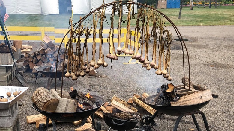 Garlic hanging over a fire at the Minnesota Garlic Festival