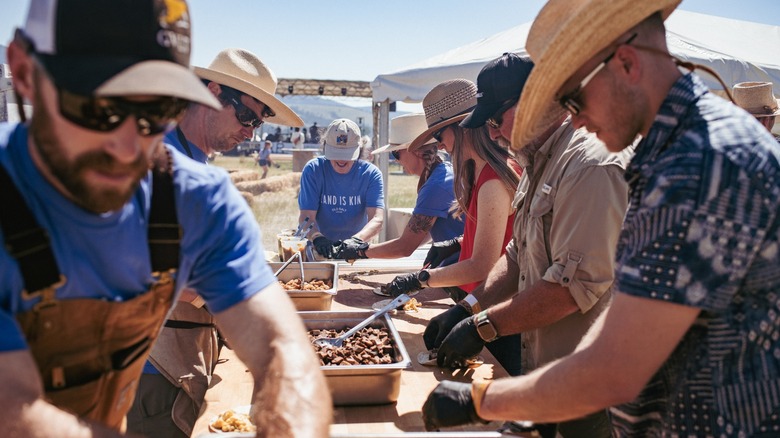 People preparing food at the Old Salt Festival