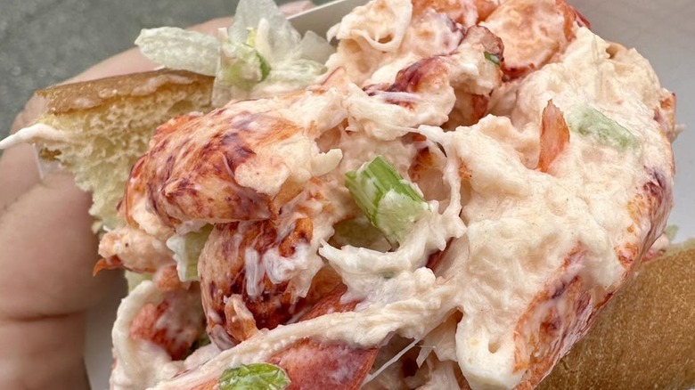 Bite of a lobster roll with lettuce and scallions at the Hampton Beach Seafood Festival