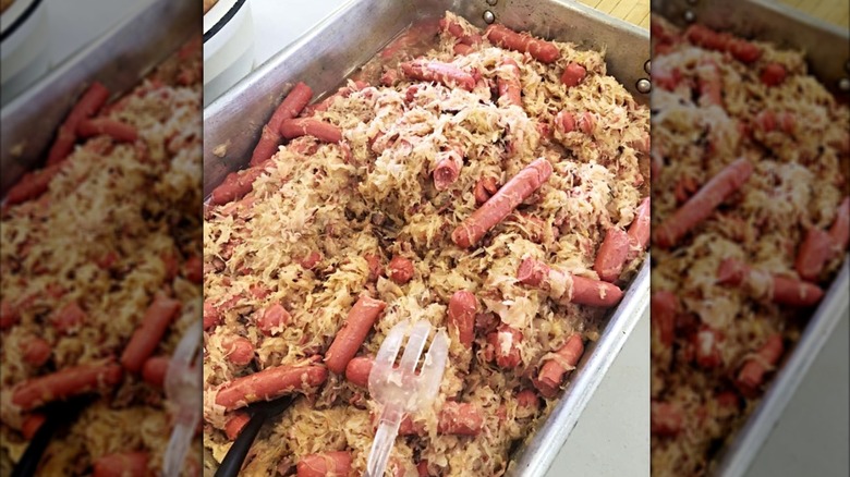 Tray of sauerkraut with sausage at Sauerkraut Day