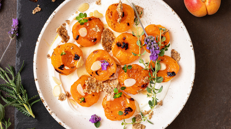 Charred apricots on plate