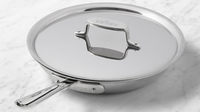 Williams Sonoma All-Clad pan on marble surface