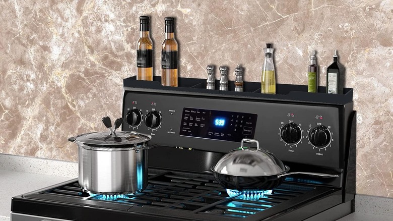 An Awoke stovetop shelf on the back of a range