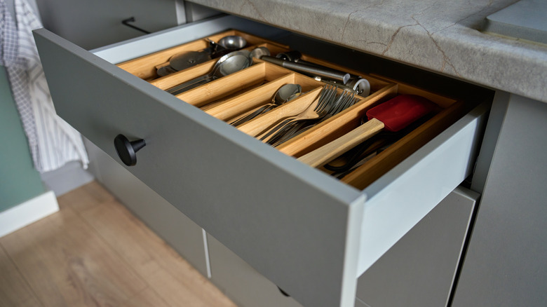 A kitchen drawer with a silverware organizer