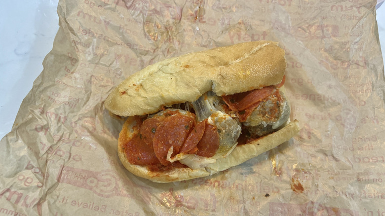 Half a Pizzeria Meatball Melt sandwich from GetGo sitting on the unwrapped paper