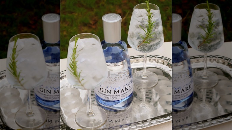 Bottle of Gin Mare with two cocktails on a metal tray