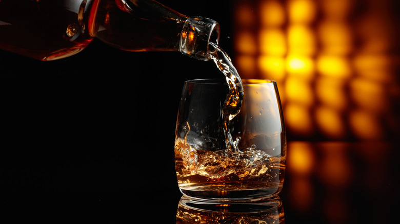 whiskey poured into glass