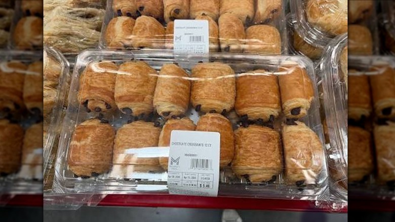chocolate croissants sitting on a display case