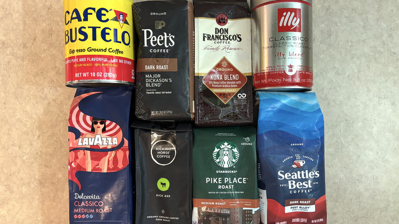 A variety of ground store-bought coffee on a neutral countertop