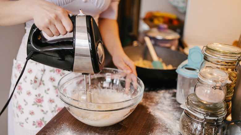 A person mixing ingredients for a recipe