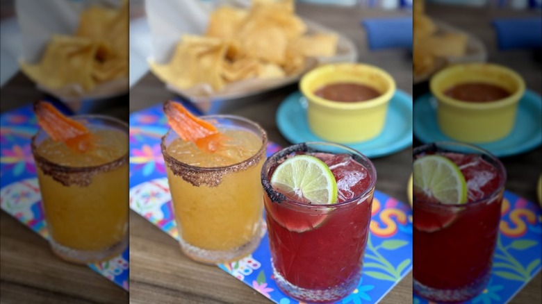 two differently flavored margaritas on a restaurant table
