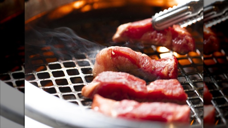 close up of beef getting cooked on a Japanese BBQ grill