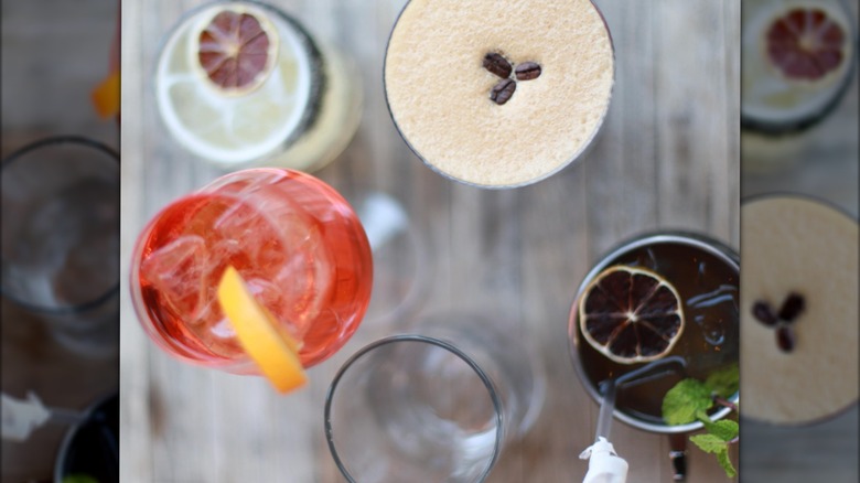 aerial view of multiple different types of cocktails at a restaurant table