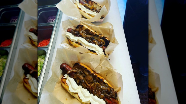 three Seattle dogs plated up from Pioneer Grill Hot Dogs