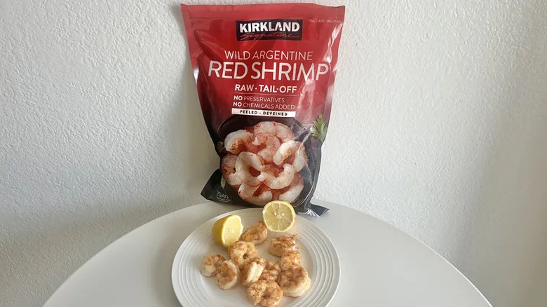 Kirkland red shrimp package behind a plate of shrimp