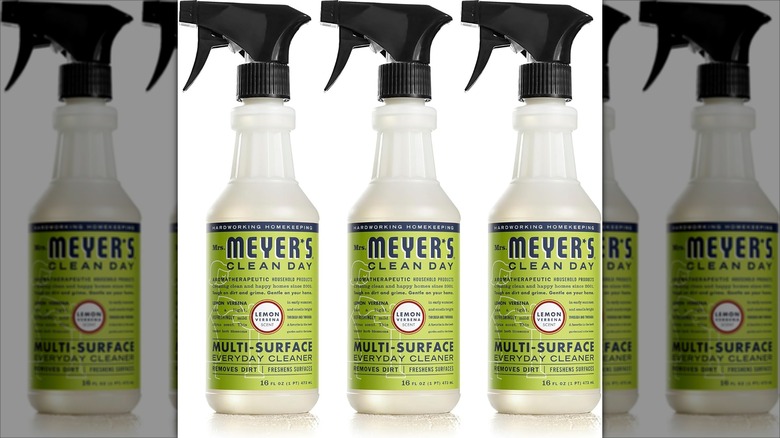 Several bottles of Mrs. Meyer's Clean Day All-Purpose Cleaner on white background