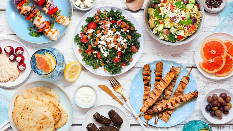 table filled with various Mediterranean dishes