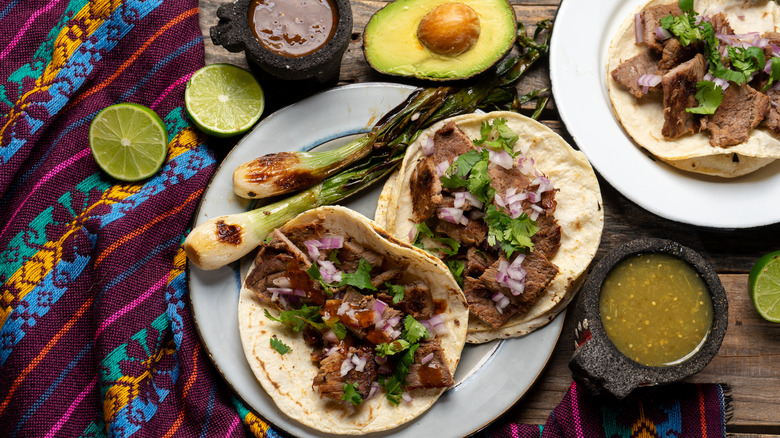 Steak tacos with limes and avocado 