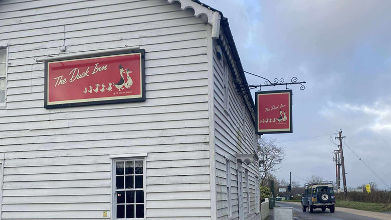 Restaurant with a red and white 'The Duck Inn' sign