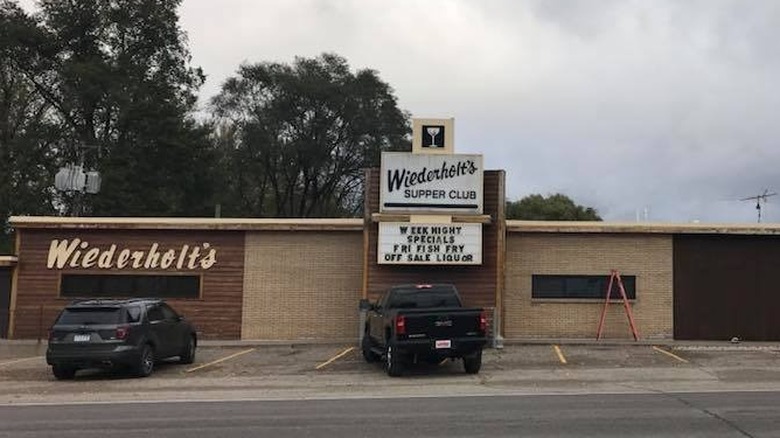 A restaurant with 'Wiederholt's Supper Club' sign outside